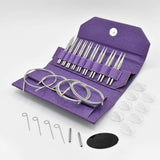 Set of knitting needles in a purple case on a white background